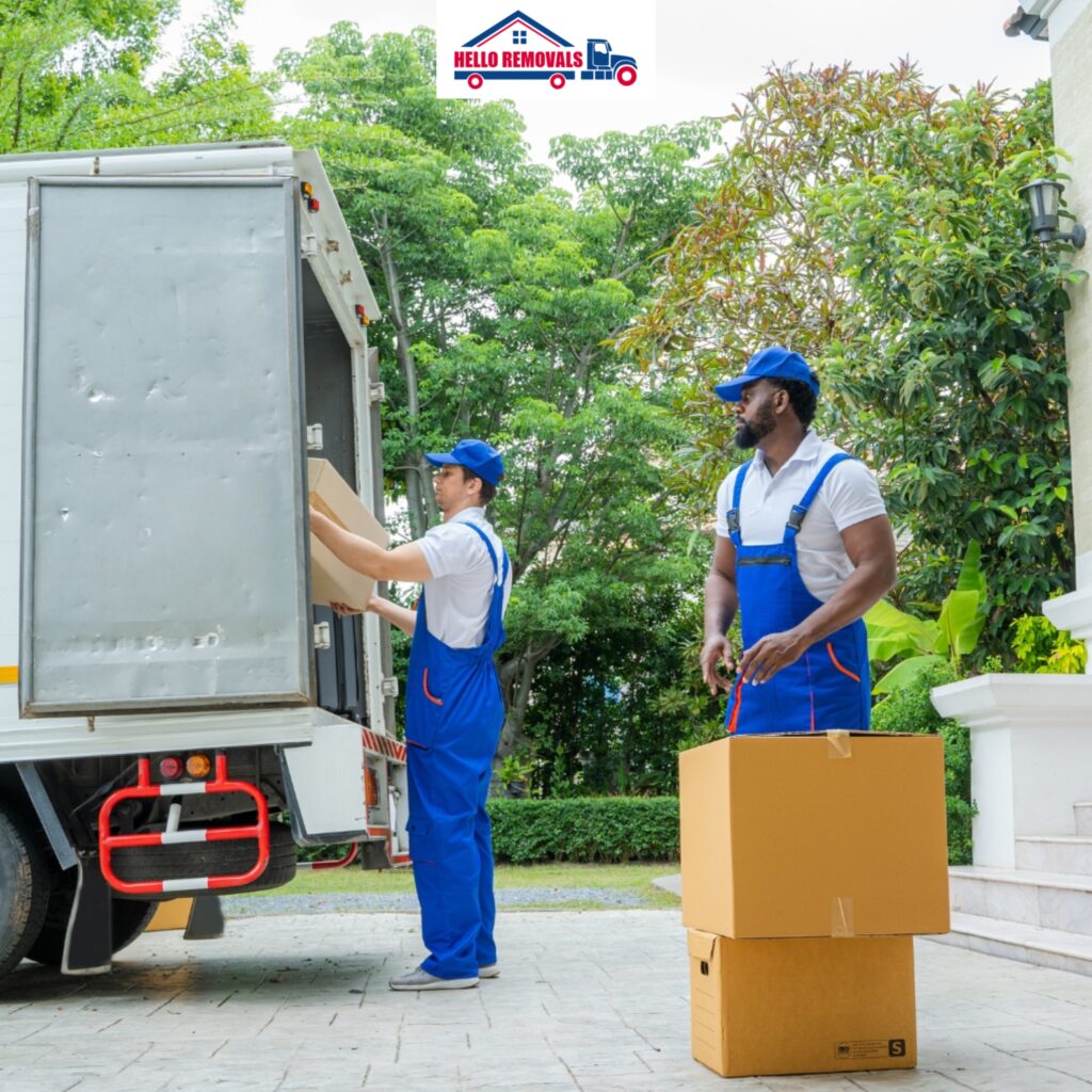 Movers loading boxes into a truck – Hello Removals.