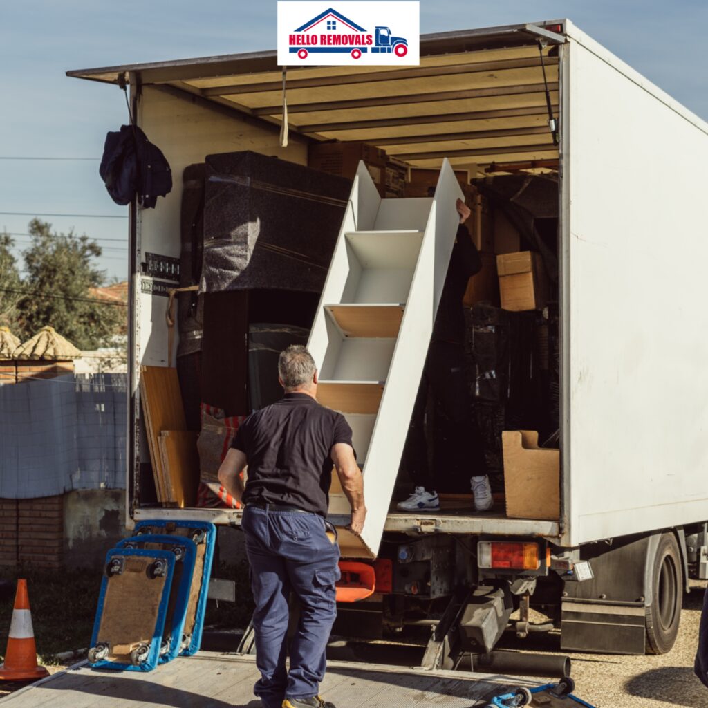 Professional movers loading furniture into a moving truck for Hello Removals