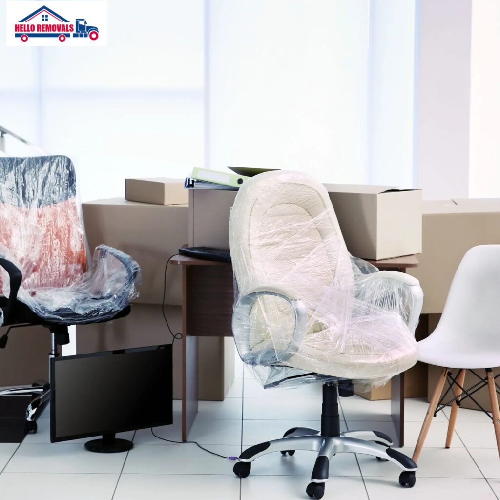 Office furniture packed with boxes during professional office relocation service.