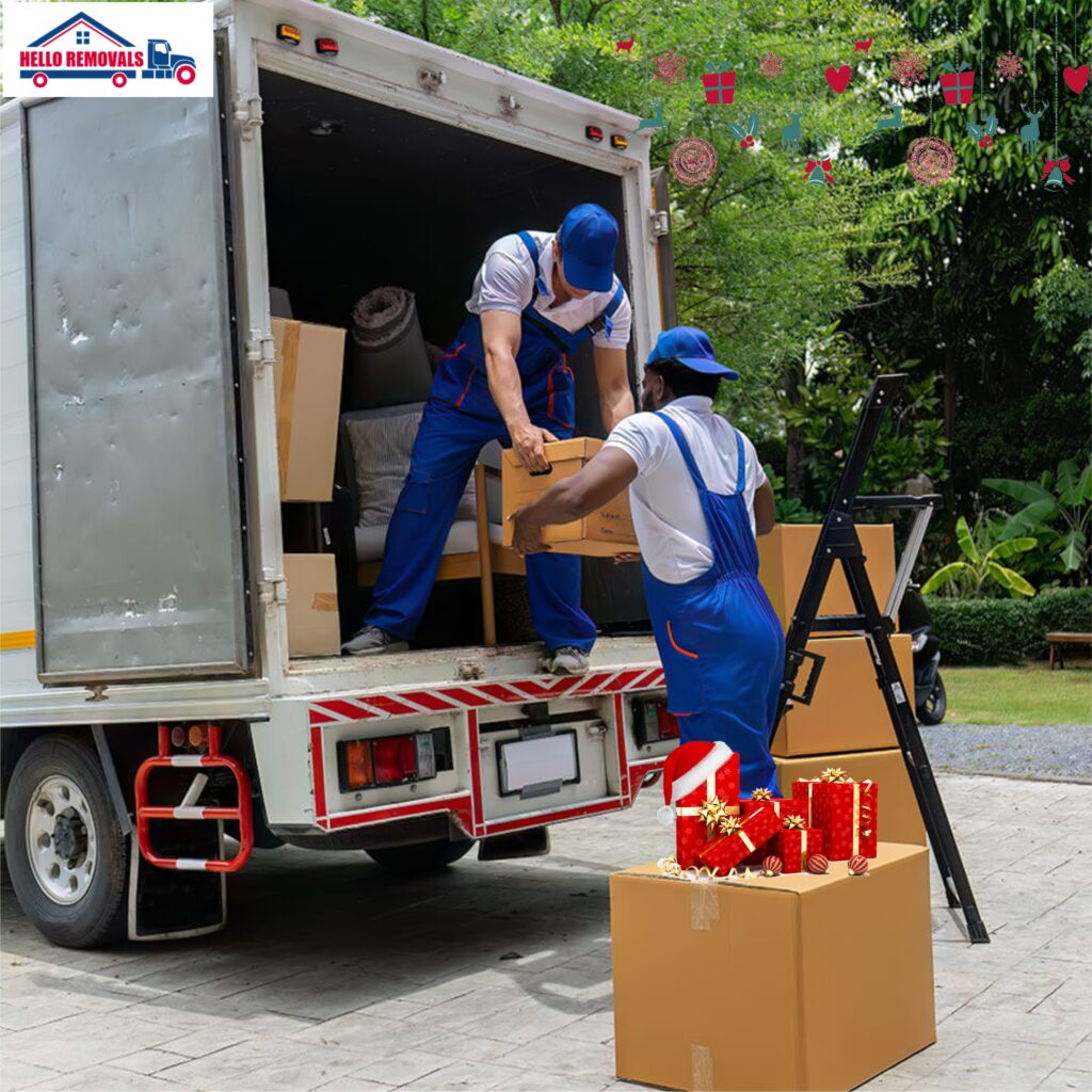 Professional movers loading boxes into a removal truck, showcasing reliable house moving services by Hello Removals.
